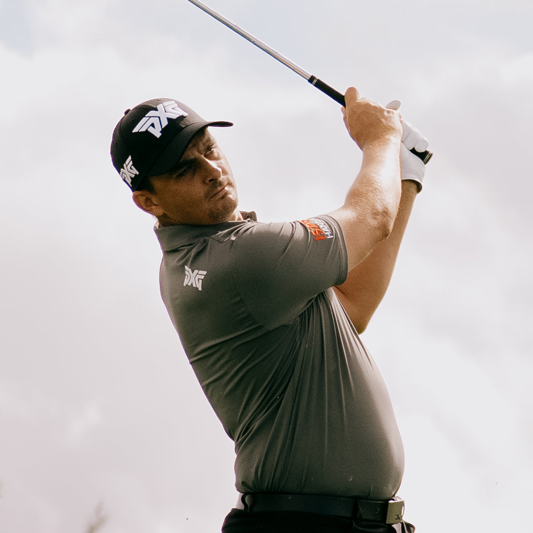 PGA Tour Pro Christiaan Bzuidenhout wearing a PXG Golf Hat on a golf course.