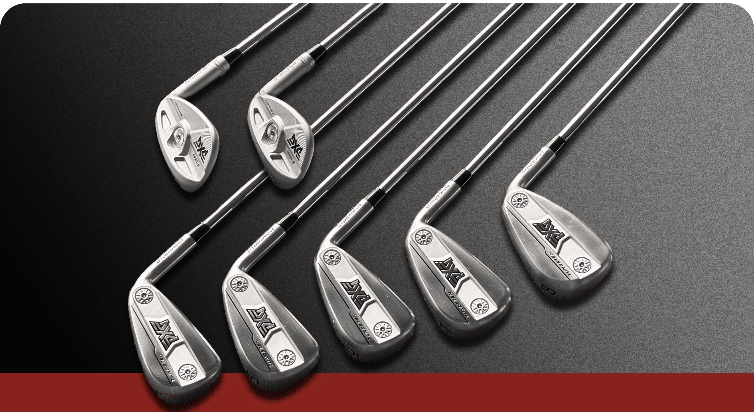A set of eight golf iron clubs arranged diagonally on a dark gray background with a red stripe at the bottom. The clubs are metallic silver with black and white branding details.