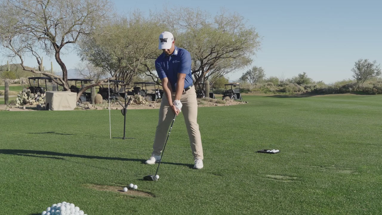 Aldrich Potieter swinging a golf club on a golf course.